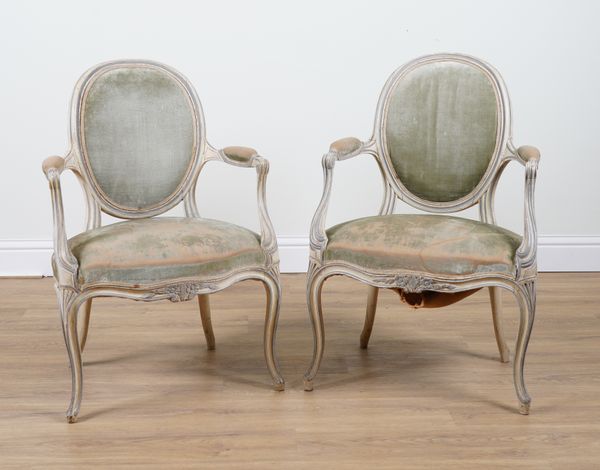 A PAIR OF GEORGE III CREAM AND GREY PAINTED OPEN ARMCHAIRS IN THE FRENCH TASTE (2)