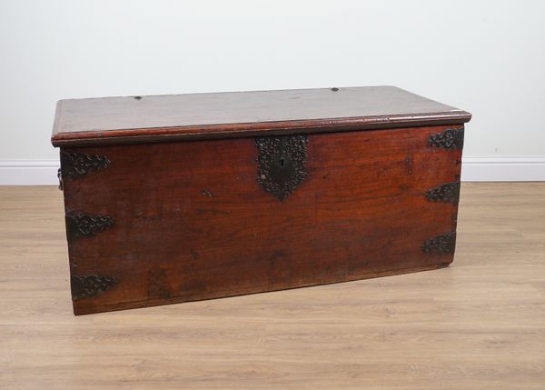 A LARGE 19TH CENTURY INDIAN BRASS BOUND TEAK RECTANGULAR LIFT TOP TRUNK