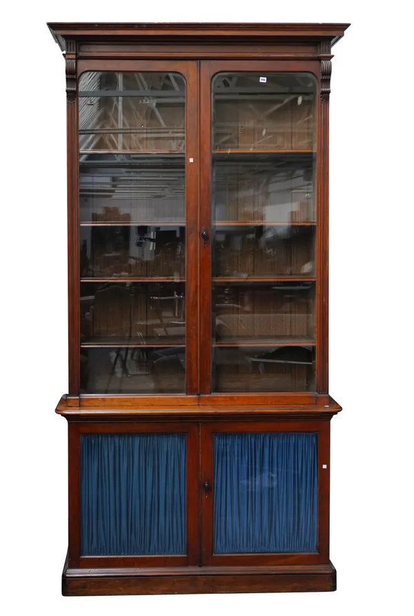 A VICTORIAN WALNUT DOUBLE HEIGHT GLAZED BOOKCASE CABINET