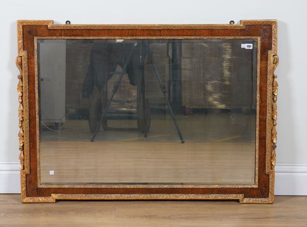 A GEORGE II STYLE PARCEL GILT WALNUT FRAMED RECTANGULAR MIRROR