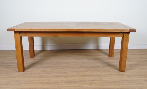 AN OAK PLANK TOP EXTENDING KITCHEN TABLE ON BLOCK SUPPORTS