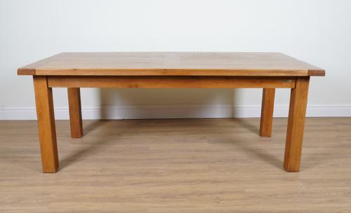 AN OAK PLANK TOP EXTENDING KITCHEN TABLE ON BLOCK SUPPORTS