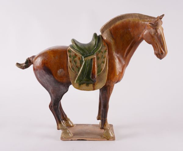 A TANG STYLE SANCAI GLAZED FIGURE OF A HORSE