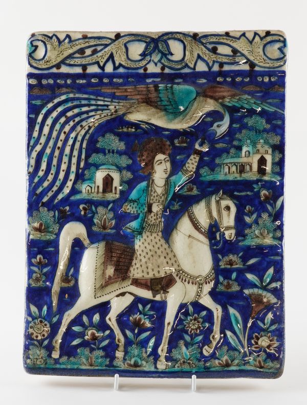 A QAJAR RECTANGULAR POTTERY TILE