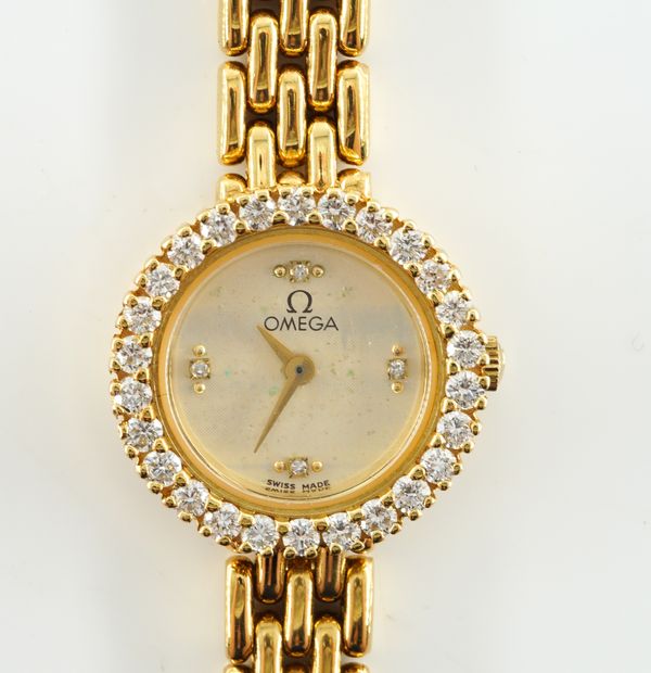 OMEGA. A LADIES 18K GOLD AND DIAMOND QUARTZ BRACELET WRISTWATCH