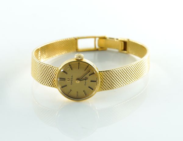 OMEGA: A LADIES 18K GOLD CASED MANUAL WIND WRISTWATCH