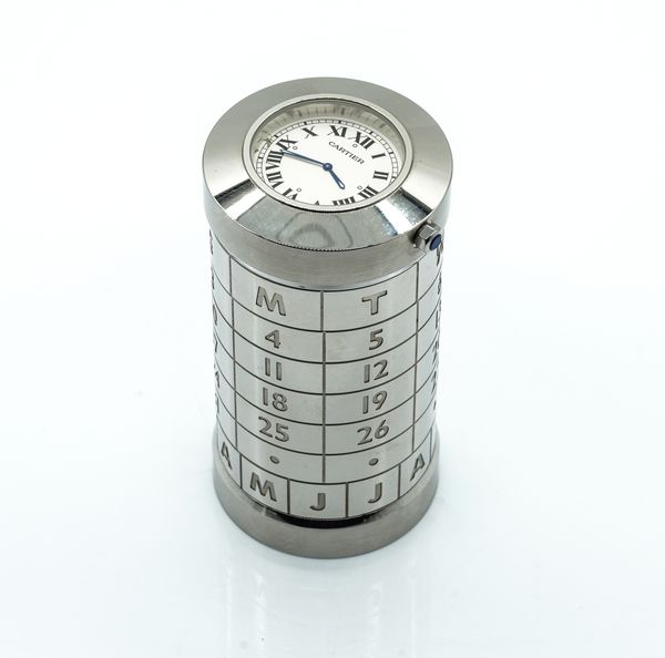 CARTIER. A STAINLESS STEEL DESK CLOCK AND CALENDAR