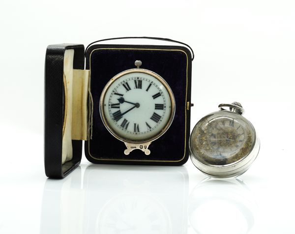 A VICTORIAN SILVER MOUNTED BEDSIDE CLOCK AND A PAPERWEIGHT DESK CLOCK (2)