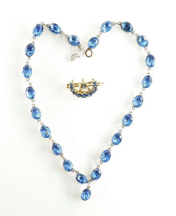 A SAPPHIRE AND SEED PEARL CRESCENT BROOCH WITH A PASTE NECKLACE