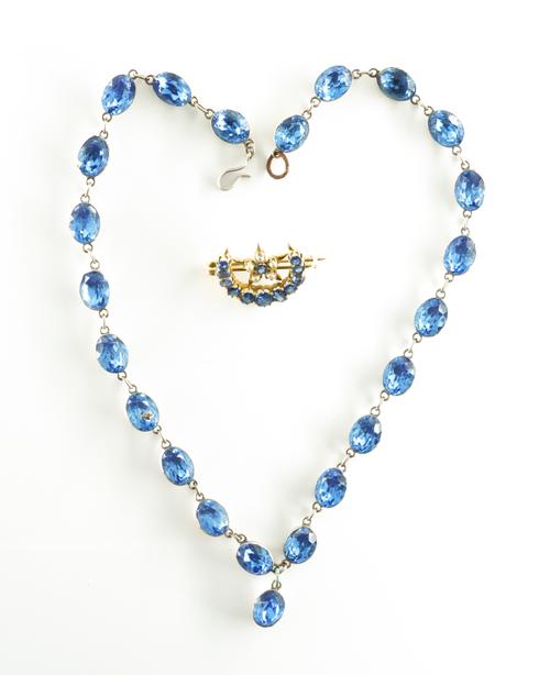 A SAPPHIRE AND SEED PEARL CRESCENT BROOCH WITH A PASTE NECKLACE