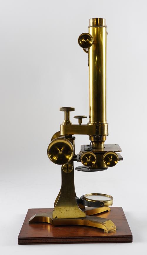 AN ENGLISH BRASS COMPOUND BINOCULAR MICROSCOPE
