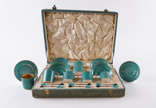 THOMAS GOODE & CO.: A SET OF SIX PARCEL-GILT SHAGREEN PATTERN PORCELAIN COFFEE CUPS AND SAUCERS