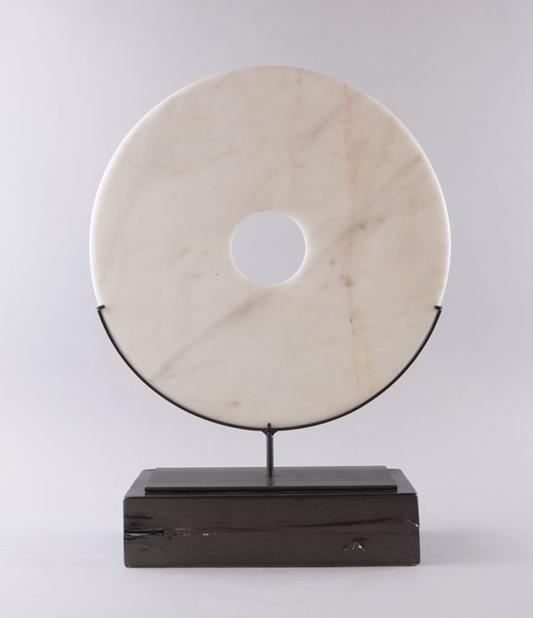 AN ABSTRACT MARBLE DISC SCULPTURE