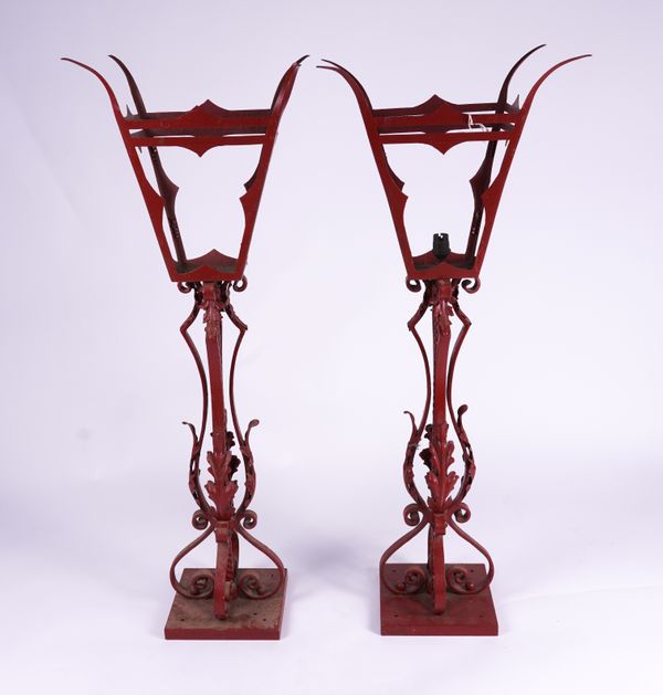 A PAIR OF RED PAINTED WROUGHT IRON PIER LANTERNS (2)