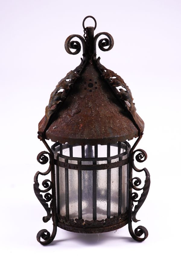 A WROUGHT AND SHEET IRON HANGING LANTERN