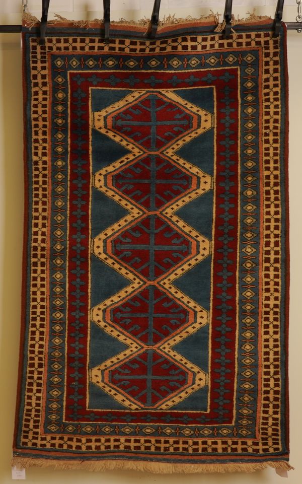 A MODERN TURKISH RUG OF CAUCASIAN DESIGN