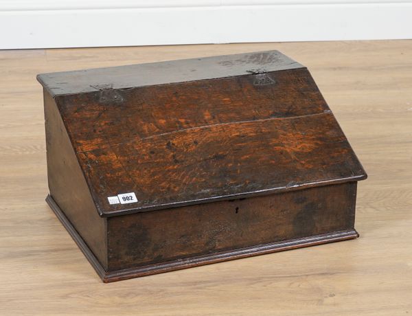 A 17TH CENTURY OAK SLOPE FRONT BIBLE BOX WITH THREE DRAWER INTERIOR