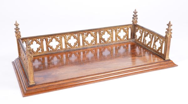 A VICTORIAN GOTHIC REVIVAL GILT METAL AND ROSEWOOD DESK STAND