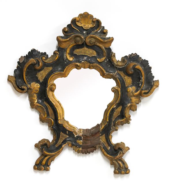 A SMALL 19TH CENTURY ITALIAN PARCEL GILT AND EBONISED SHAPED MIRROR