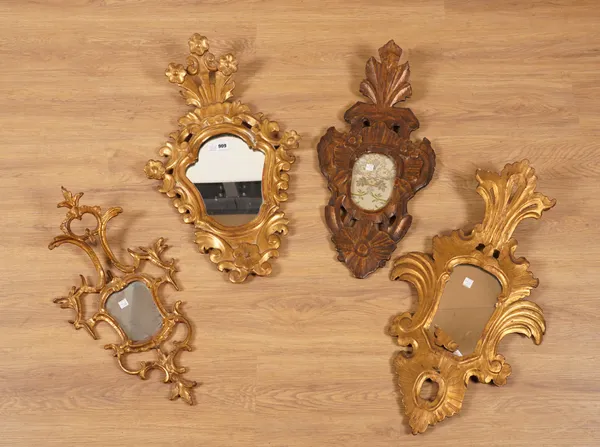 A GROUP OF FOUR SIMILAR SHAPED LATE 18TH CENTURY GILT FRAMED FLORENTINE CARTOUCHE SHAPED WALL MIRRORS (4)