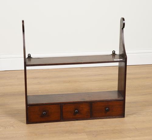 AN EARLY 19TH CENTURY MAHOGANY HANGING THREE DRAWER SPICE SHELF