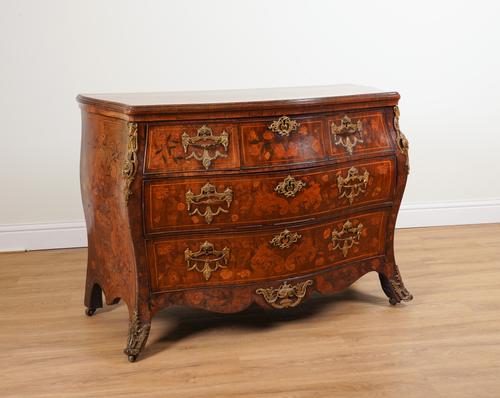 AN 18TH CENTURY DUTCH GILT METAL MOUNTED MARQUETRY INLAID WALNUT SERPENTINE BOMBE FOUR DRAWER COMMODE