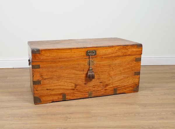 A 19TH CENTURY BRASS BOUND CAMPHOR WOOD TRUNK