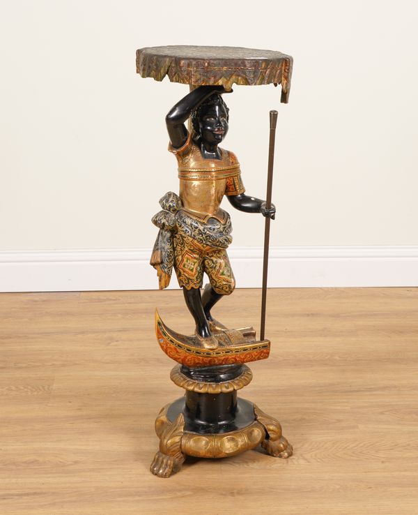 A VENETIAN POLYCHROME PAINTED AND GILT DECORATED GONDOLA FIGURE TORCHERE STAND