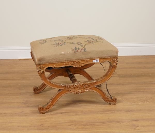 A 19TH CENTURY CARVED GILT WOOD X-FRAME STOOL