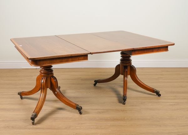 A GEORGE III STYLE SATINWOOD BANDED MAHOGANY EXTENDING DINING TABLE