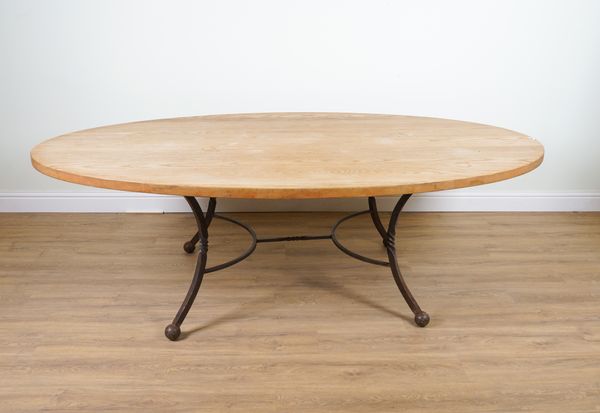 A MODERN OVAL OAK KITCHEN TABLE ON WROUGHT IRON BASAE