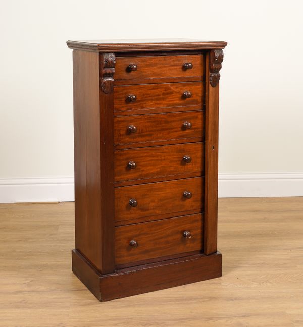 A VICTORIAN MAHOGANY GRADUATED SIX DRAWER WELLINGTON CHEST WITH LOCKING BAR