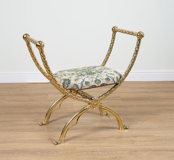 A MODERN LACQUERED BRASS X-FRAME STOOL ON PAW FEET