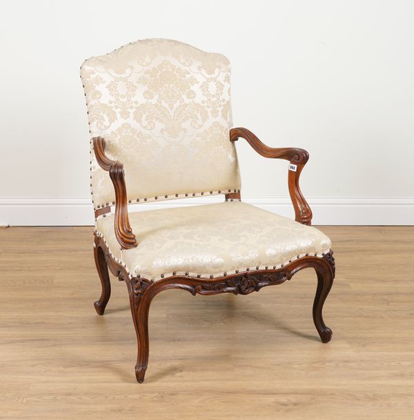 AN 18TH CENTURY FRENCH STYLE CARVED WALNUT FRAMED OPEN ARMCHAIR