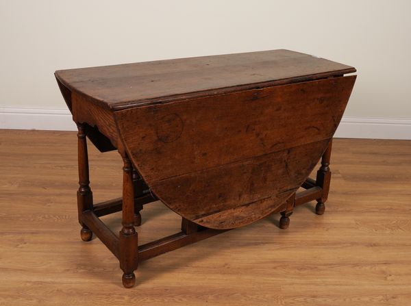 A 17TH CENTURY AND LATER OAK OVAL GATE-LEG DINING TABLE