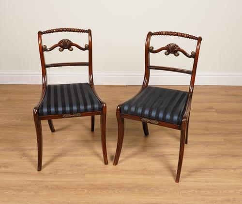 A PAIR OF REGENCY GILT-METAL MOUNTED FAUX ROSEWOOD SIDE CHAIRS (2)