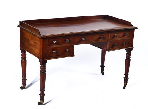 A LATE REGENCY MAHOGANY WRITING DESK