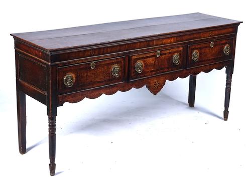 A LATE GEORGE III MAHOGANY INLAID OAK DRESSER BASE
