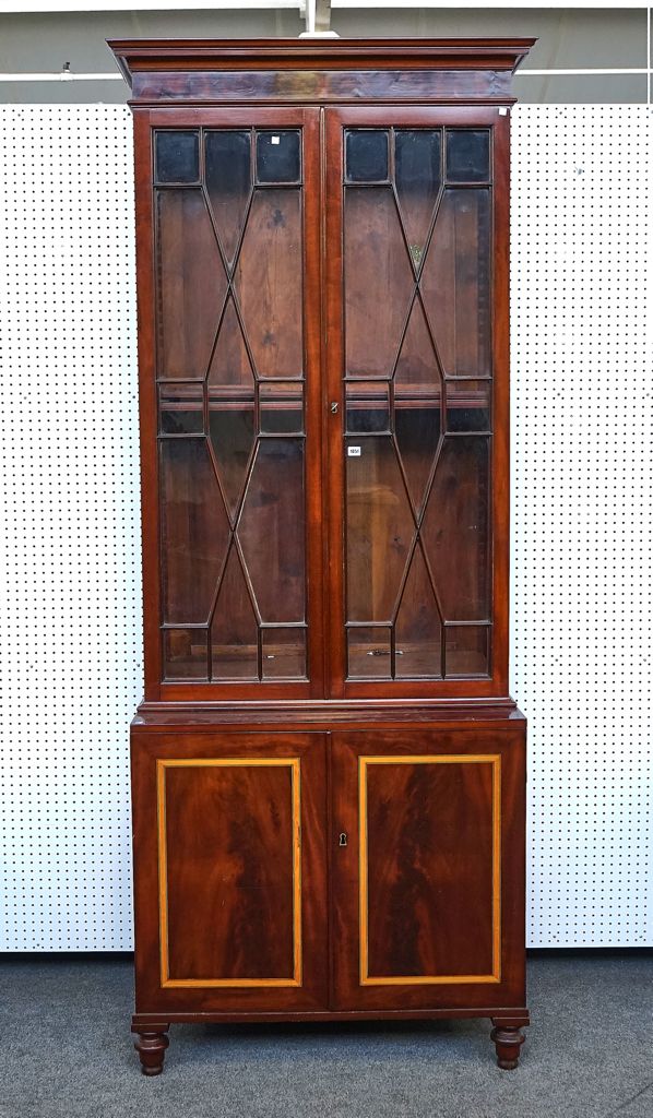 A 19TH CENTURY INLAID MAHOGANY BOOKCASE CABINET