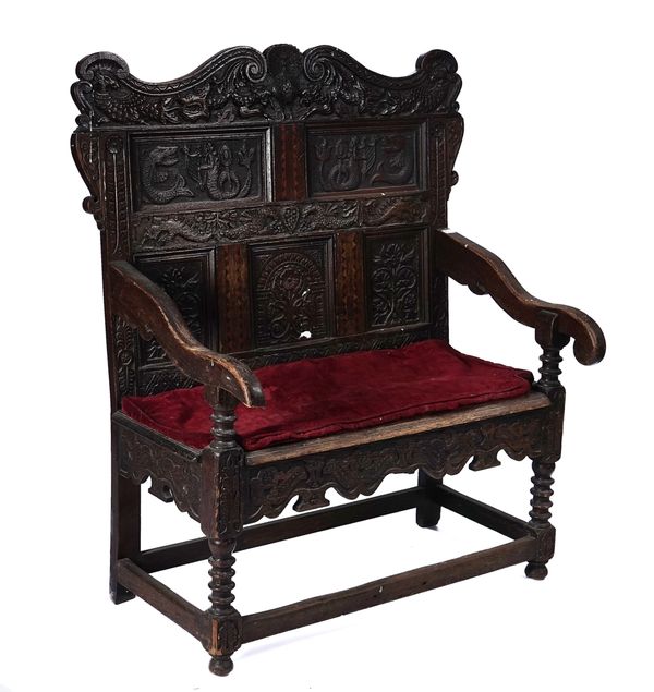 AN OAK SETTLE INCORPORATING 17TH CENTURY ELEMENTS