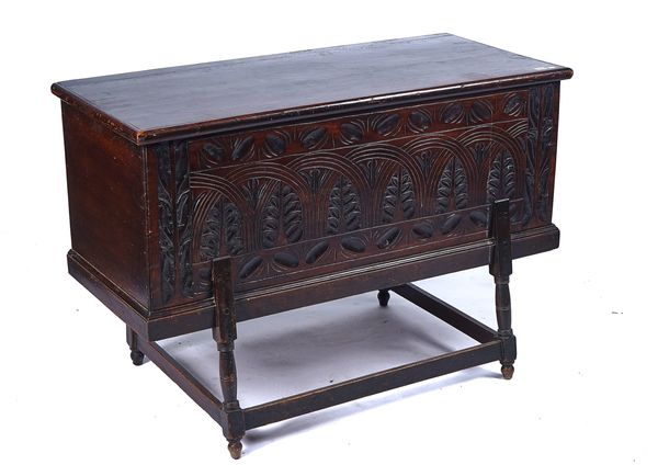 A 19TH CENTURY CARVED WALNUT CHEST ON STAND