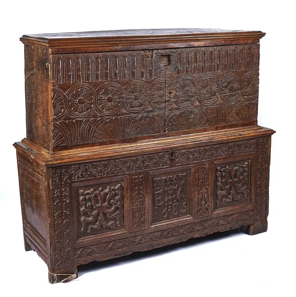 AN ASSOCIATED CARVED OAK COFFER ON CHEST, INCORPORATING EARLIER ELEMENTS