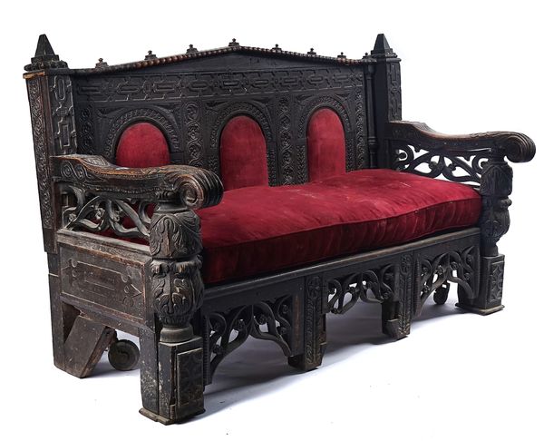 A CARVED OAK SETTLE INCORPORATING 17TH CENTURY AND 19TH CENTURY ELEMENTS