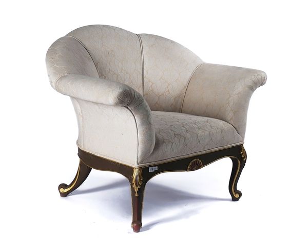 A LARGE MODERN SHELL BACK ARM CHAIR