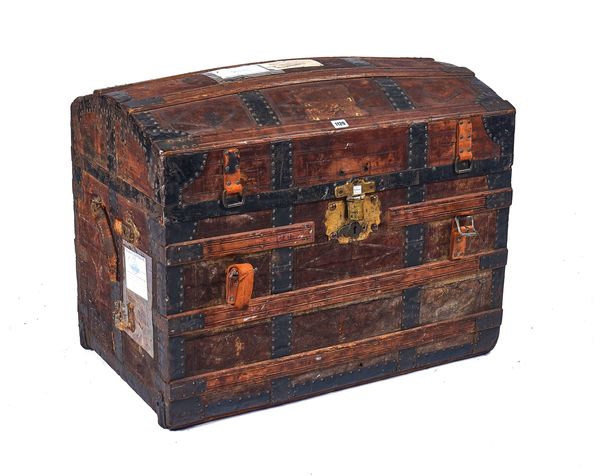 AN EARLY 20TH CENTURY LEATHER VENEERED DOMED TOP TRAVELLING TRUNK