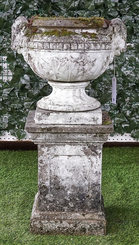 A WHITE PAINTED RECONSTITUTED STONE JARDINIERE