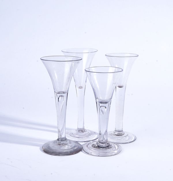 FOUR PLAIN STEMMED WINE GLASSES (4)