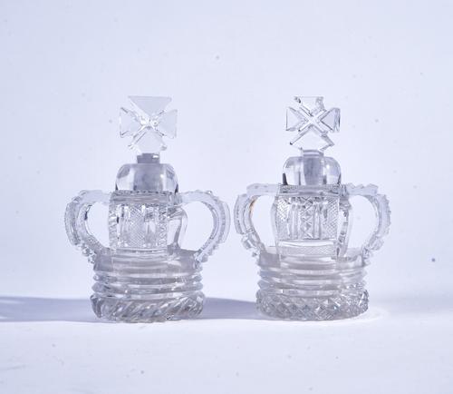 TWO SMALL CUT GLASS OPENWORK CROWN SCENT BOTTLES AND STOPPERS