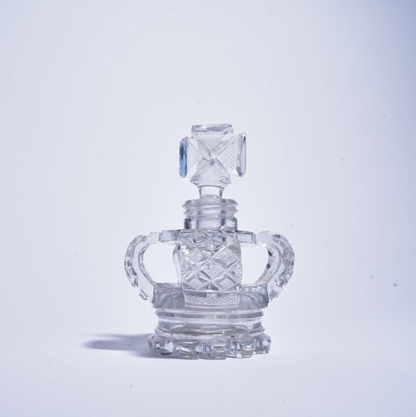 A CUT GLASS OPENWORK CROWN SCENT BOTTLE AND STOPPER (2)