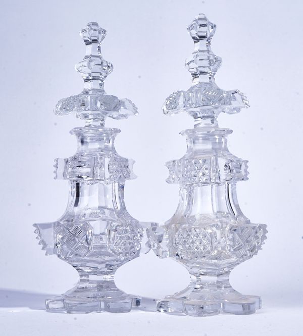 A PAIR OF TALL CUT GLASS SCENT BOTTLES AND STOPPERS (4)